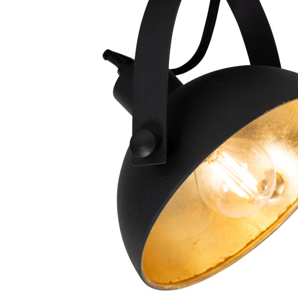 Schwarzer Strahler mit goldener Innenseite und Glühbirne