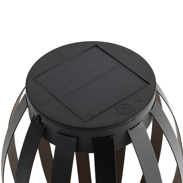 Oberseite einer schwarzen Solarleuchte mit integriertem quadratischem Solarpanel und einem Einschaltknopf.
