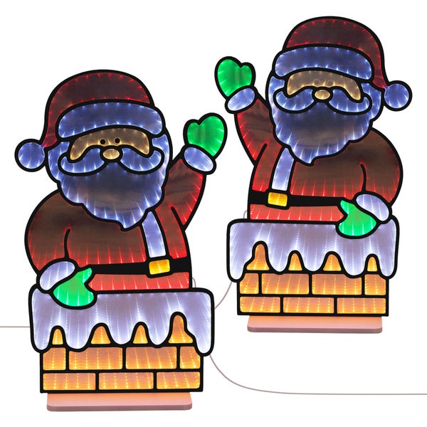 Zwei beleuchtete Weihnachtsmann Figuren im Kamin mit LED Unendlichkeitseffekt für die Innen und Außendekoration.