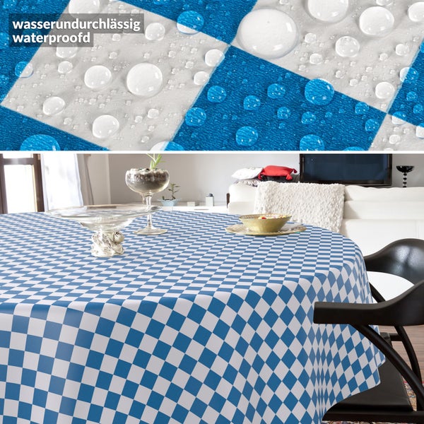 Runde Tischdecke mit Karomuster in einem Wohnzimmer, die Detailaufnahme zeigt die wasserabweisende Oberfläche mit Wassertropfen.