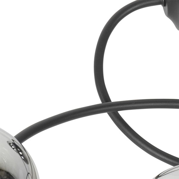 Detailaufnahme einer Lampe mit schwarzen Streben