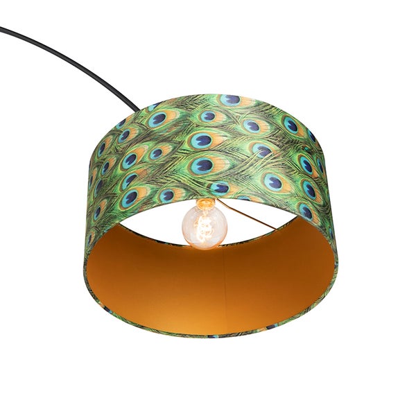 Pendelleuchte mit Pfauenfeder-Muster und eingeschalteter Glühbirne