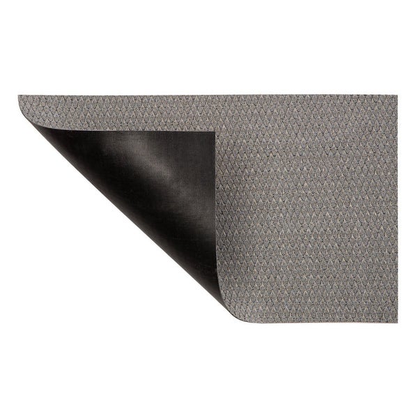 Fußmatte mit geometrischem Muster und umgeschlagener Ecke, die die Rückseite zeigt