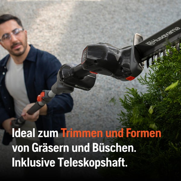 Husqvarna Akku-Heckenschere mit Teleskopstiel beim Trimmen von Büschen