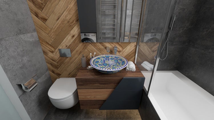 Badezimmer mit Waschbecken, Toilette, Badewanne und Waschmaschine