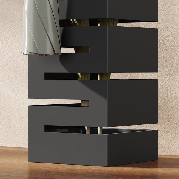 Moderner Schirmständer aus Metall in Schwarz mit geometrischem Zickzack-Design, gefüllt mit Regenschirmen.