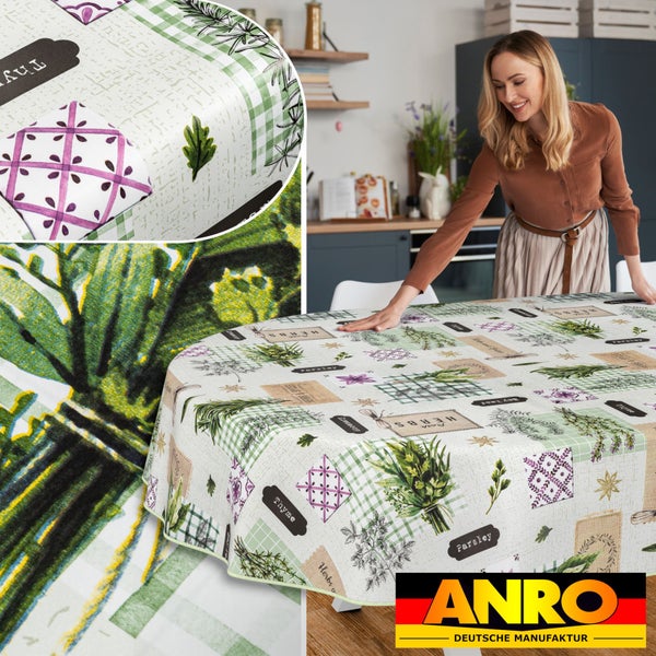 Frau drapiert Küchentisch mit ANRO Tischdecke mit Kräutermuster