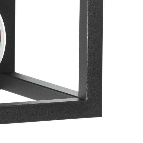 Detailaufnahme einer schwarzen würfelförmigen Lampe