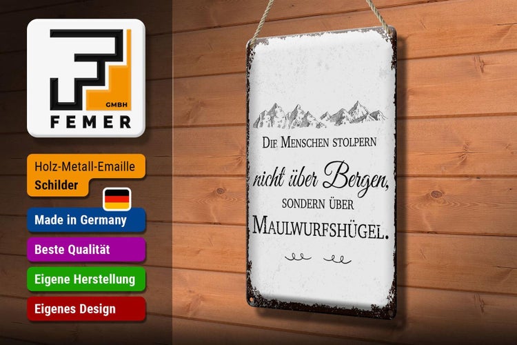 Blechschild Spruch Menschen stolpern nicht über Bergen 20x30cm