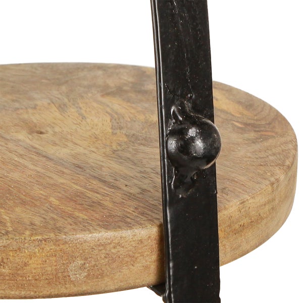 Detailaufnahme eines runden Tisches mit einer Platte aus Mangoholz und einem schwarzen Metallrahmen