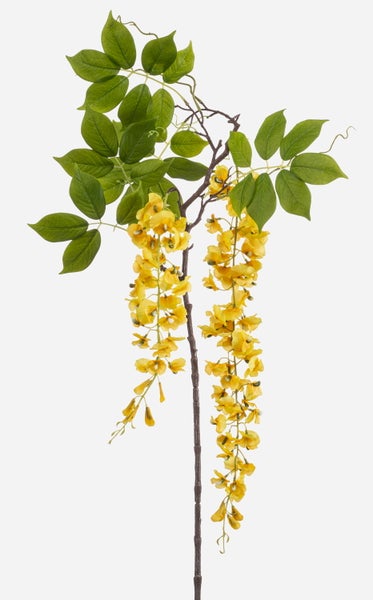 Nahaufnahme eines Stiels einer künstlichen Lilie mit grünen Blättern und einem weiß-rosa Blütenblatt.