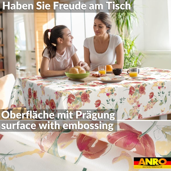 Wachstuchtischdecke mit Blumenmuster und geprägter Oberfläche in einer Esszimmerszene, ANRO Logo.