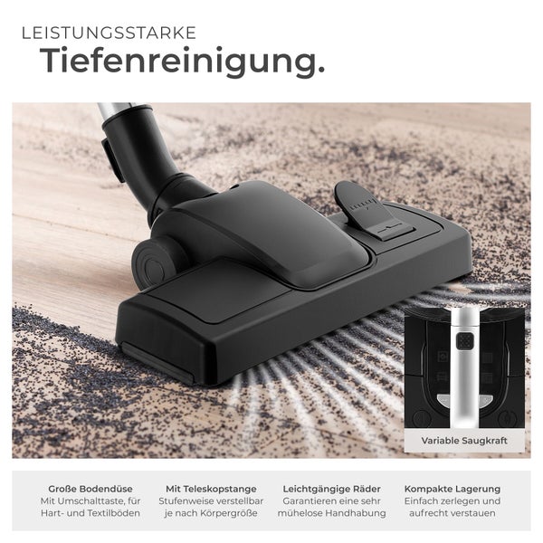 Umschaltbare Bodendüse eines Staubsaugers bei der Tiefenreinigung auf einem Boden mit Details zu Teleskopstange und variabler Saugkraft.