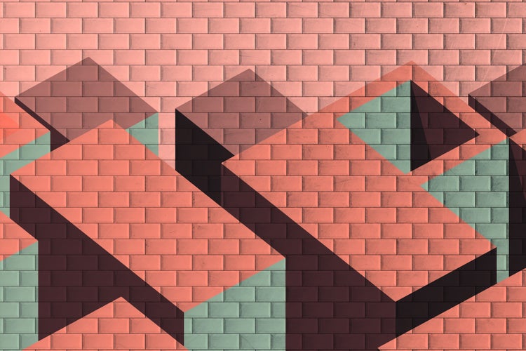 Abstraktes Wanddesign mit geometrischen 3D Formen auf einem Ziegelmauer Hintergrund.