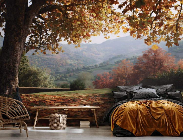 Fototapete mit Herbstlandschaft im Schlafzimmer mit Bett, Bank und Korbsessel