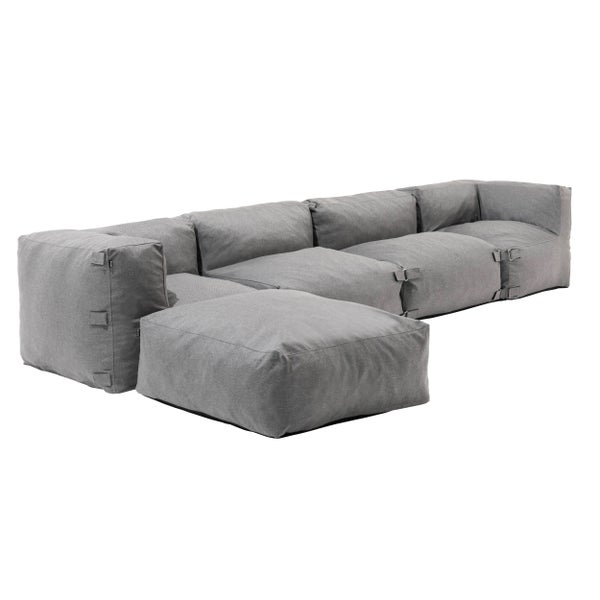 Modulares Sofa Set in Grau, Lounge-Sofa bestehend aus gepolsterten Elementen mit Textilbezug.