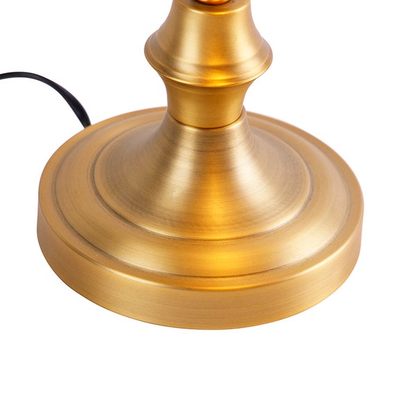 Detailansicht des goldenen Lampenfußes