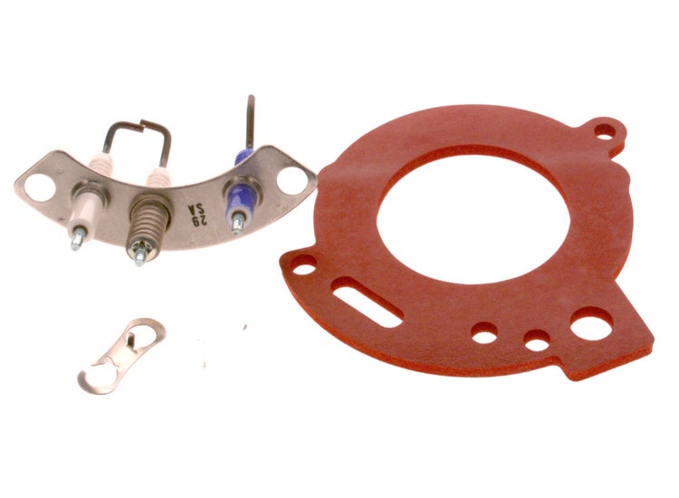 Wartungsset für Heizungsanlagen bestehend aus einer Zündelektrode auf einer Metallplatte, einer roten Dichtung und einer kleinen Metallklammer.