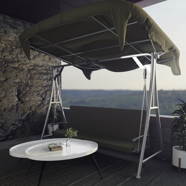 Garten Hollywoodschaukel mit Sonnendach auf einer Terrasse mit Tisch und Pflanzen vor einer Steinwand.