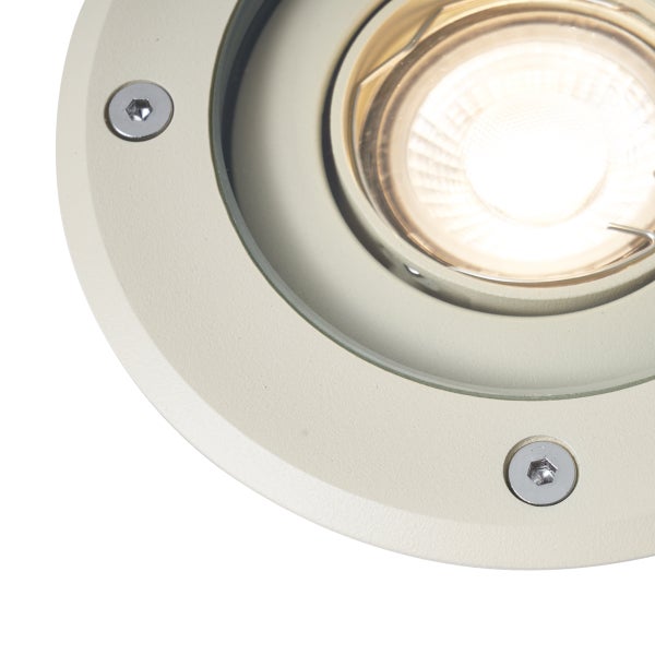 Runder Bodeneinbaustrahler aus Metall mit sichtbaren Schrauben und eingeschalteter LED.