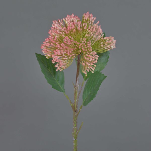 Künstliche Skimmia, Kunstblume mit rosa Blütenknospen und grünen Blättern an einem Stiel.