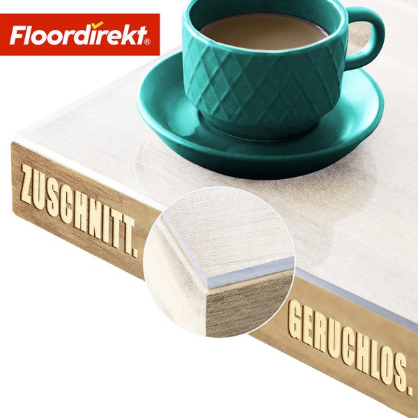 Dekorplatte mit Tasse und Untertasse, mit den Aufschriften Zuschnitt und Geruchlos sowie dem Floordirekt Logo