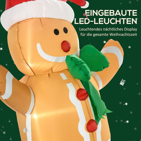 Aufblasbarer brauner Lebkuchenmann mit integrierter Beleuchtung, roter Weihnachtsmütze und grünem Schal als Weihnachtsdekoration.