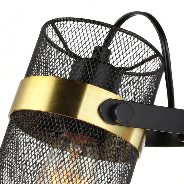 Nahaufnahme einer schwarzen Metallgitterlampe mit goldfarbenem Detail