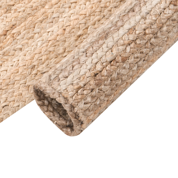Handgeflochtener Juteteppich aus Naturfaser, beige, grobe Flechtstruktur.