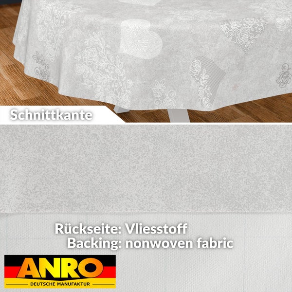 Rundes Wachstuch mit Herz- und Blumenmuster, Vliesstoff-Rückseite und Schnittkante. ANRO Deutsche Manufaktur Logo.