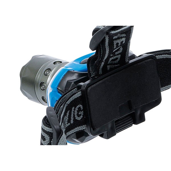 Dekorative Szene mit einer stehenden Bambuslaterne, einem Buch, Kissen und einer Zimmerpflanze.