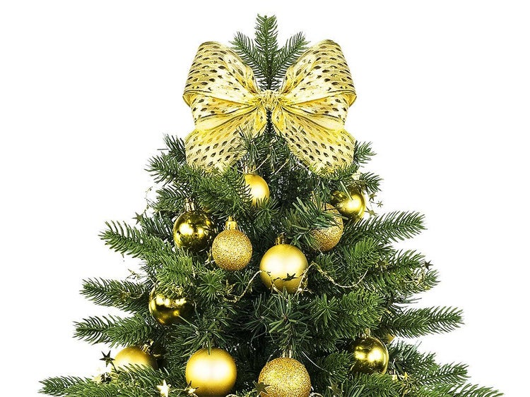 Weihnachtsbaumspitze in Form einer Schleife mit Weihnachtskugeln an einem künstlichen Weihnachtsbaum.
