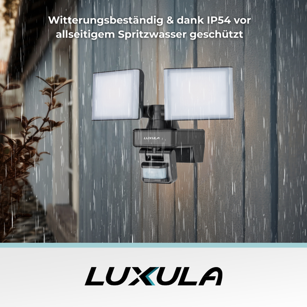 Luxula LED-Außenstrahler mit Bewegungsmelder an einer Wand bei Regen