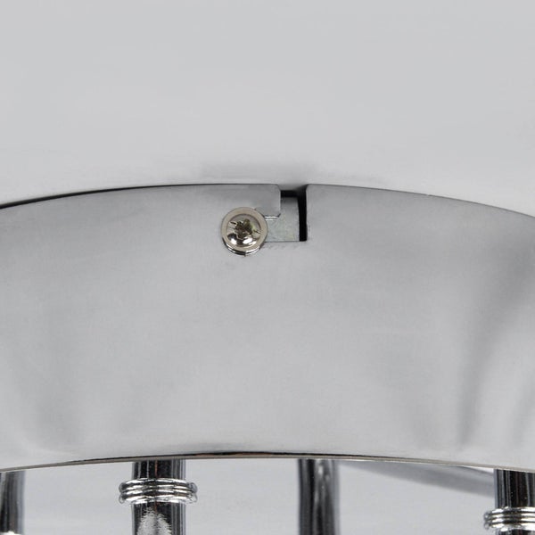 Moderne LED-Deckenleuchte aus Metall in Chrom-Optik mit sechs geschwungenen Lichtleisten in einem hellen Raum.