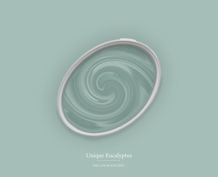 Wandfarbe The Color Kitchen Unique Eucalyptus in einem Farbeimer mit Wirbelstruktur.