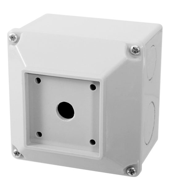 Lichtgraues Kunststoffgehäuse für Drucktaster, quadratisch, mit vier Schrauben und runder Aussparung für Bedienelemente.