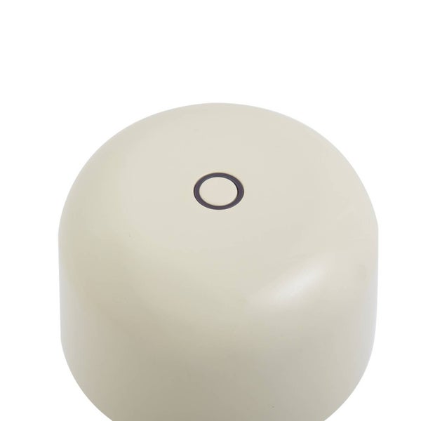 Zylindrischer Deckel in Beige mit runder Oeffnung in der Mitte.