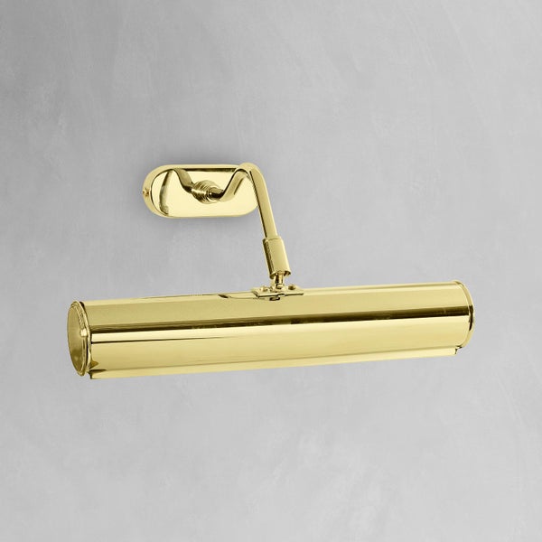 Goldfarbene Wandleuchte zur Bildbeleuchtung