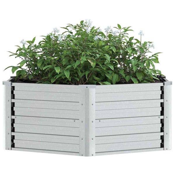 Hochbeet aus Metall in eckiger Form bepflanzt mit grünen Sträuchern und kleinen weißen Blüten.