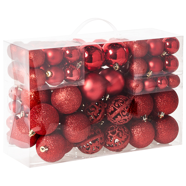 Set aus roten Christbaumkugeln in verschiedenen Ausführungen wie glänzend, matt und glitzernd in einer transparenten Tragebox.
