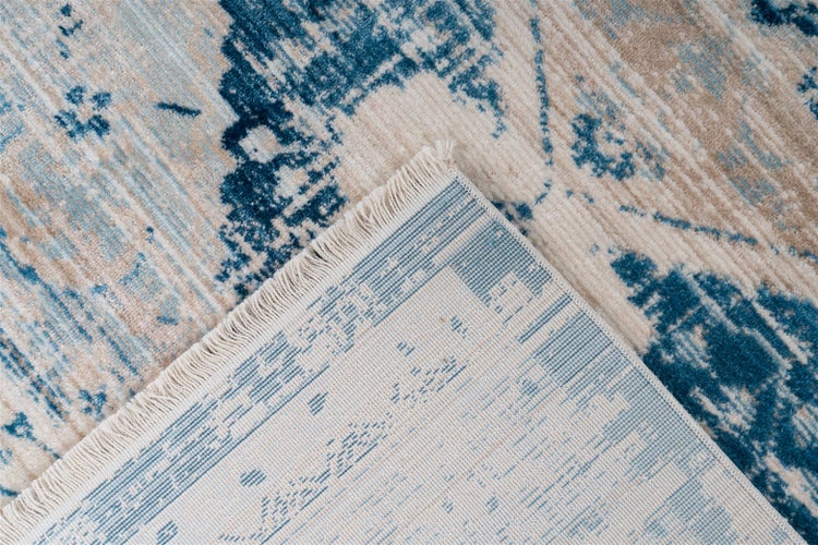 Vintage-Teppich mit zentralem Medaillon und ornamentaler Bordüre in Blau und Beige, orientalisches Design.