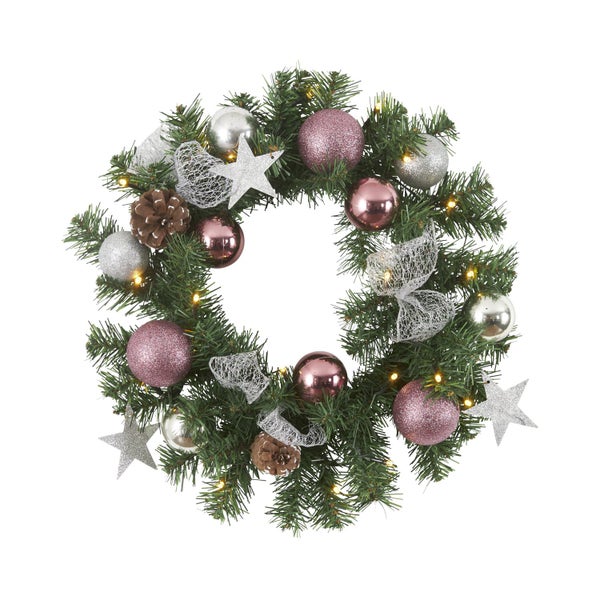 Weihnachtlicher Türkranz mit Kugeln, Sternen, Schleifen und Zapfen