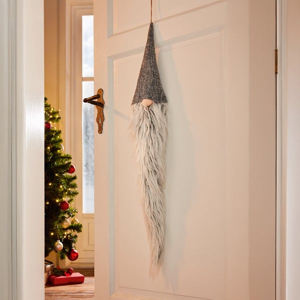 Dekorativer Türschmuck als Weihnachtswichtel mit Bart