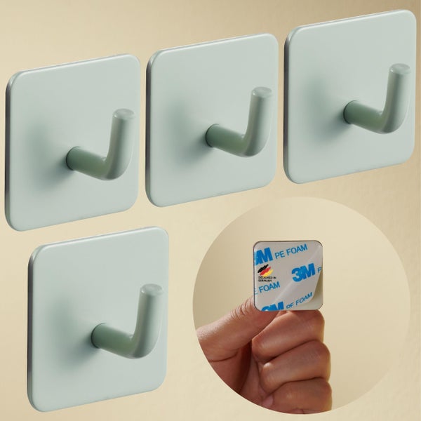 Vier quadratische selbstklebende Wandhaken mit J-Haken, in Deutschland entworfen und Rückseite mit 3M Logo.