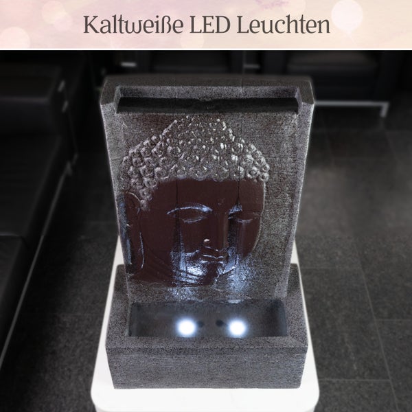 Zimmerbrunnen mit Buddha-Relief und zwei kaltweißen LED-Leuchten im Wasserbecken.