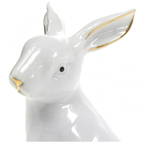 Dekorativer Porzellan Hase mit goldenen Akzenten als Osterdekoration