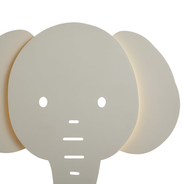 Beigefarbene Wandleuchte in Elefantenform, stilisierter Kopf mit Ohren und Ausschnitten für Augen und Rüssel.