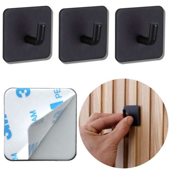 Drei quadratische, selbstklebende Wandhaken mit Detailansicht der Klebefläche und Anwendung an einer Holzwand.