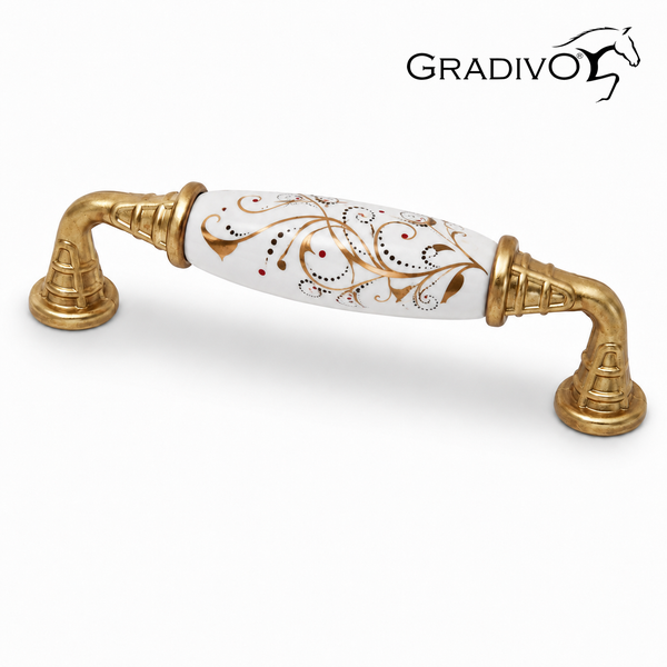 Möbelgriff aus Keramik und Metall mit weißem Mittelstück, goldfarbenem Ornament und GRADIVO Logo.