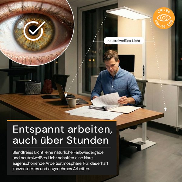 Mann arbeitet am Schreibtisch unter einer Bürostehleuchte mit neutralweißem, blendfreiem und augenschonendem Licht mit hoher Farbwiedergabe.